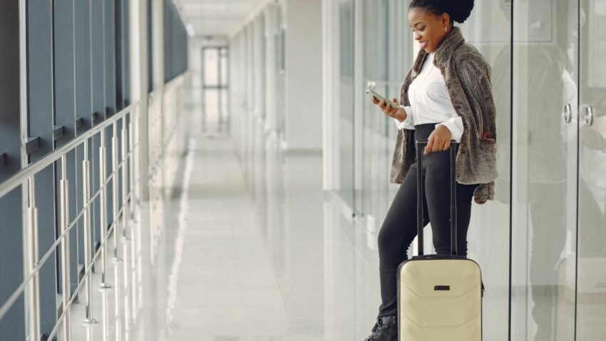A picture of a black woman witha suitcase